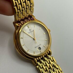 Titan womeny Gold Watch with date and White Dial #589
